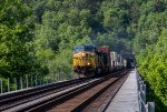 CSX 503 leads eastbound stacks through the Graham Tunnel and over the Potomac River bridge